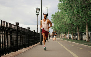 A man running at full speed to maximize his energy and sports endurance.